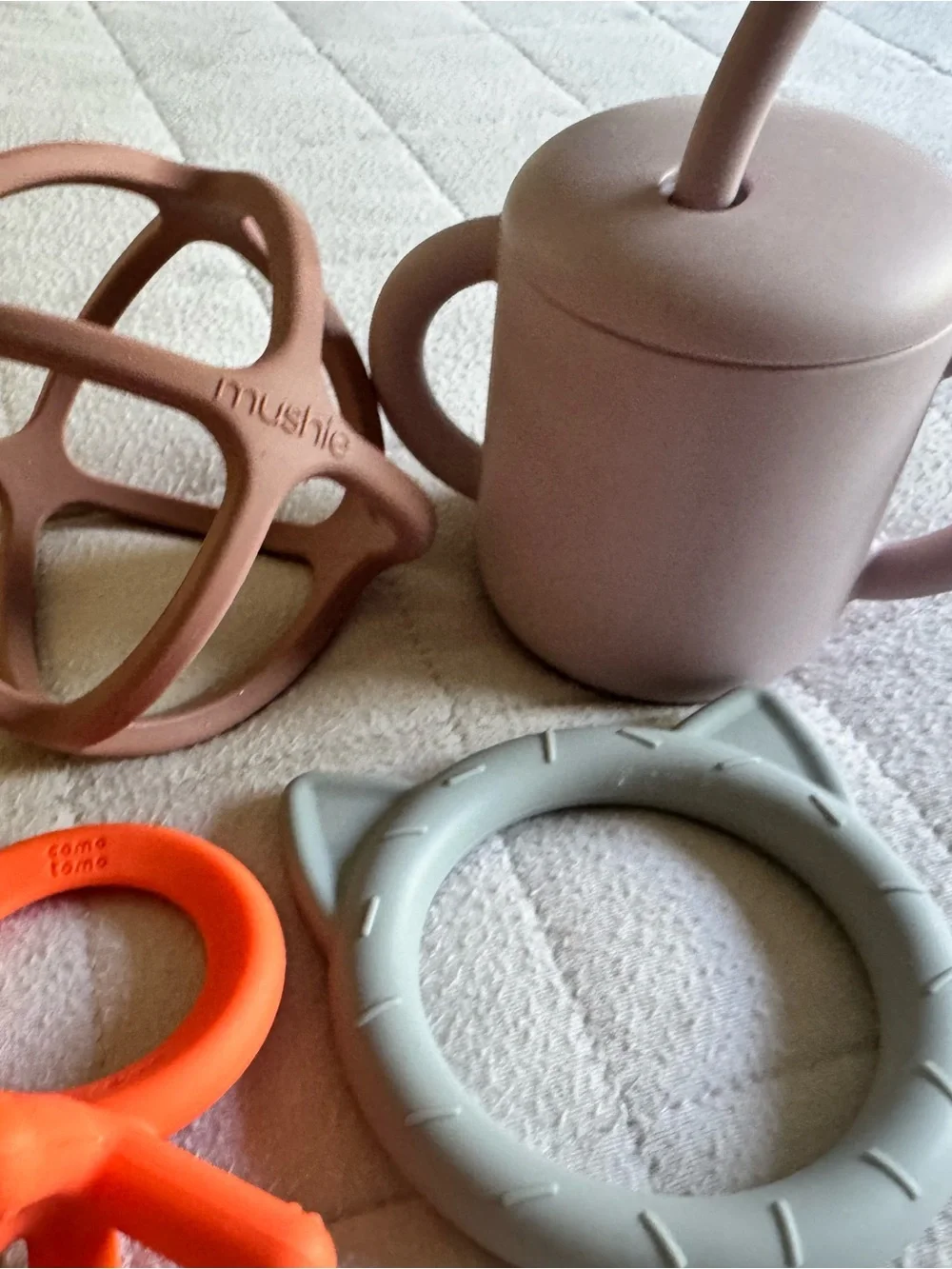 Mushie lot of teethers, spoons, snack catcher, sippy cup